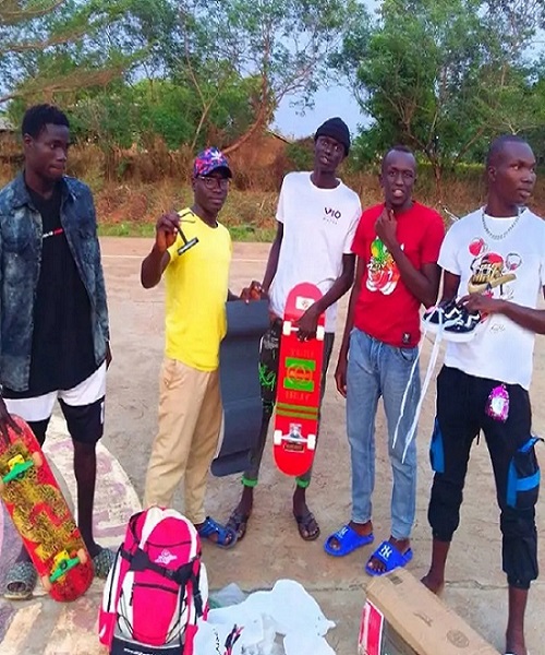 group photo of skateboarders recieving gifts from David Brunz from San Antonio US