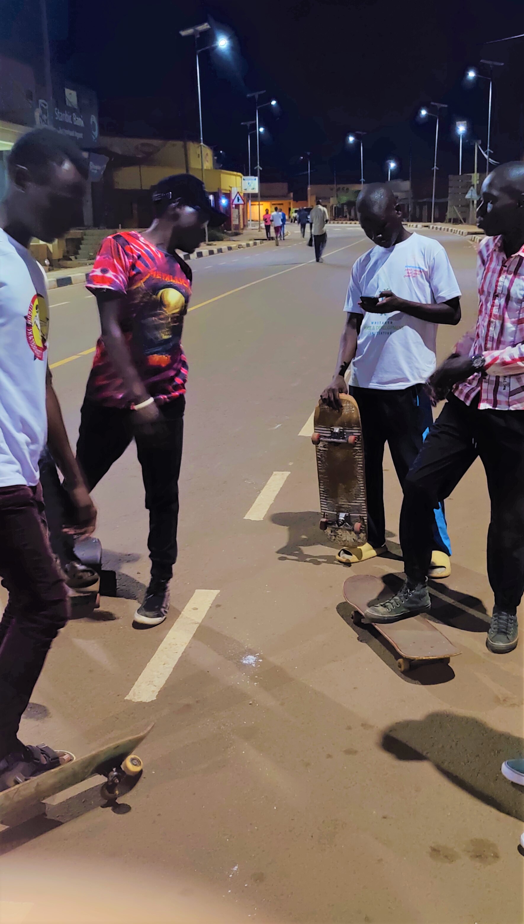 KiSS Skateboard members skating at Stanbic Street